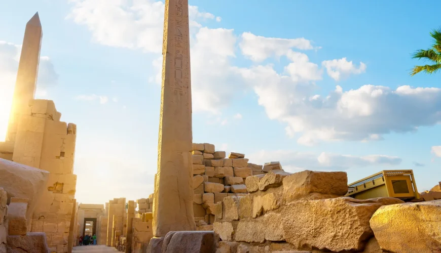 Ancient Egyptian obelisks at sunset, Luxor Temple.