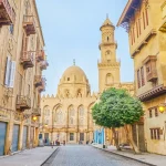 Historic Middle Eastern street leading to grand mosque.