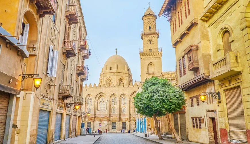 Historic Middle Eastern street leading to grand mosque.