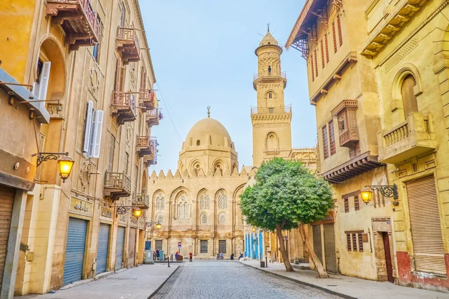 Historic Middle Eastern street leading to grand mosque.