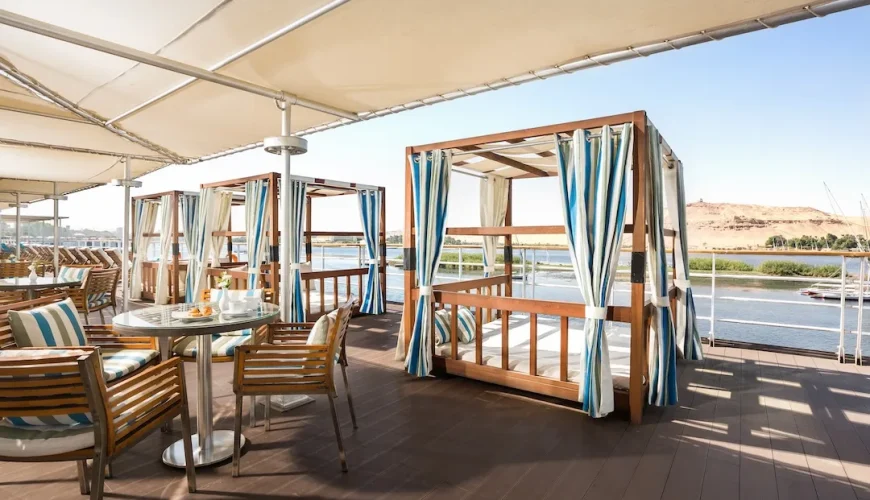 River view outdoor dining area on cruise deck.