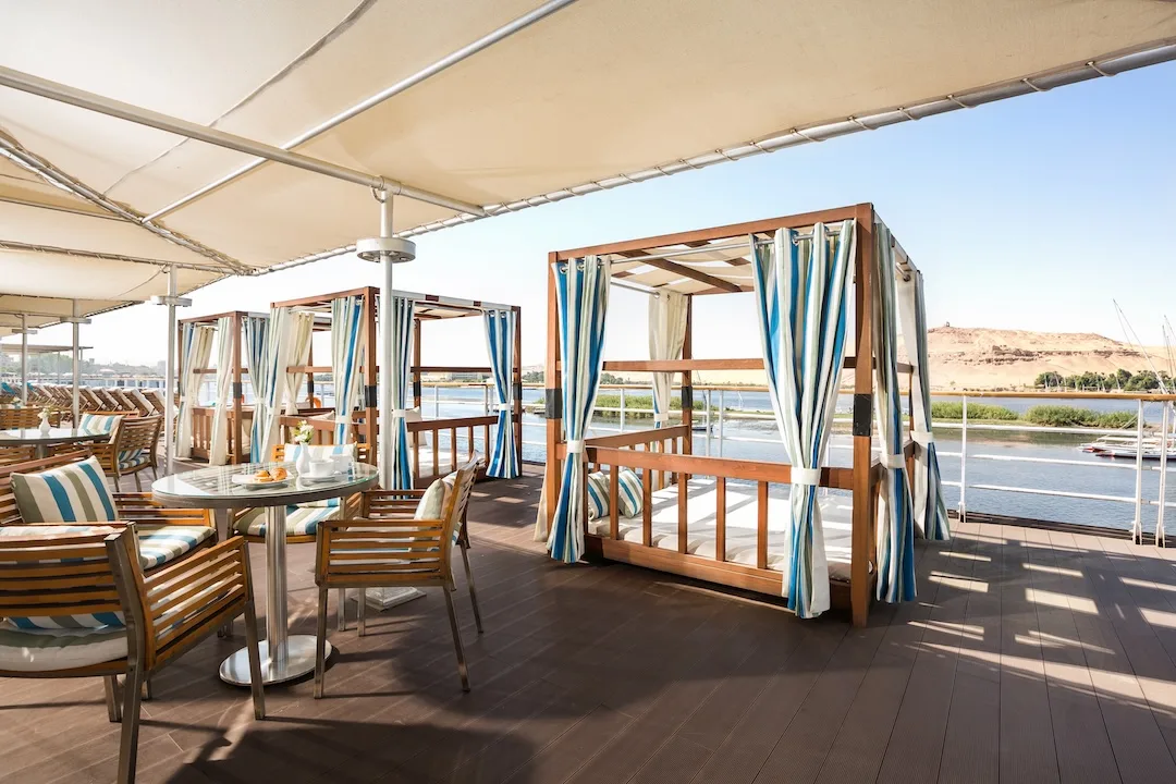 River view outdoor dining area on cruise deck.