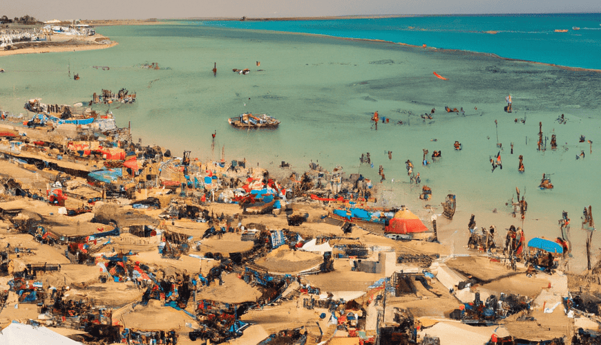 Crowded beach, turquoise water, boats, temporary shelters
