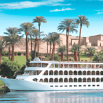 River cruise ship on Nile near palm trees and ruins.