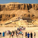 Tourists visiting an arid historical site.
